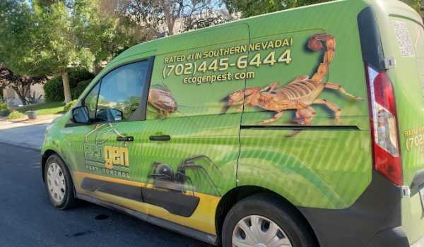 A green van with an Ecogenpest control advertisement displays a large scorpion and spider graphic. The text includes a phone number, website, and claims the Ecogen service is “Rated #1 in Southern Nevada.”.